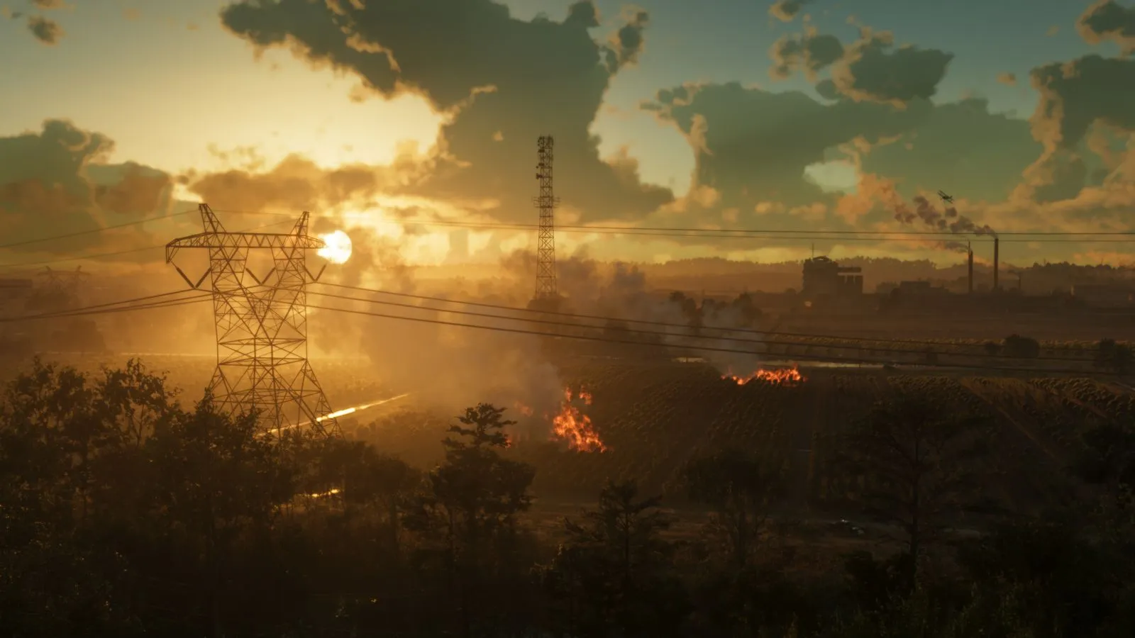 Atardecer sobre la refinería de Ambrosia con torres eléctricas y humo