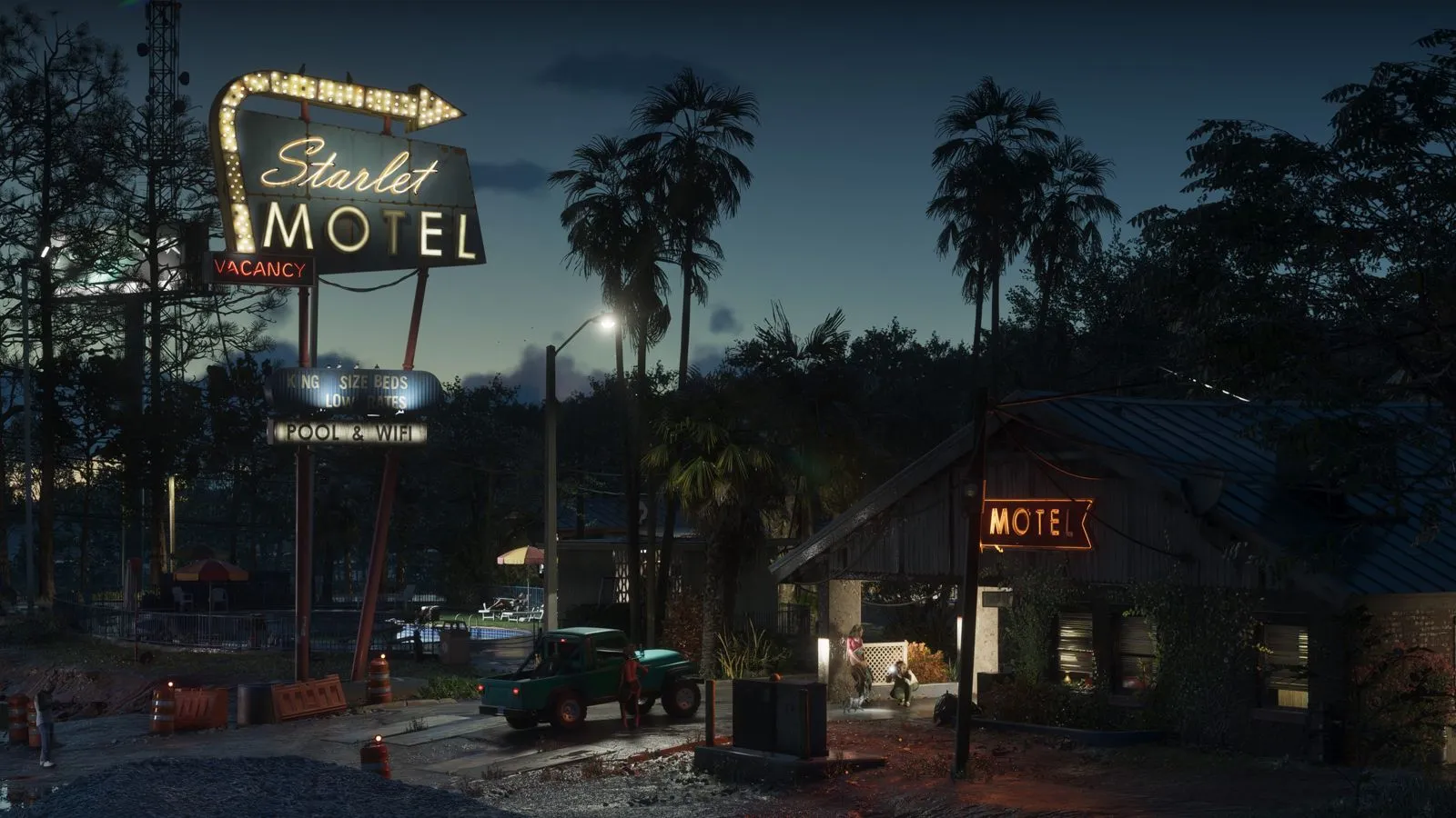 Motel Starlet de noche rodeado de palmeras en Port Gellhorn